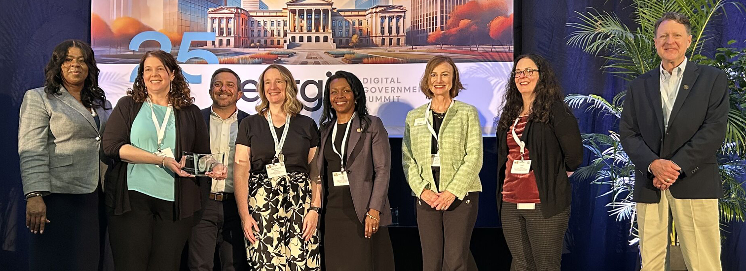 employees from Cobb County Government accepting a Findhelp award at their conference