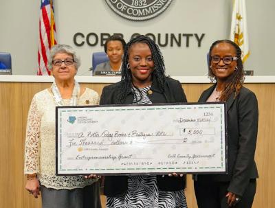 BOC entrepreneurship and innovation grant winner receives giant check for $5,000