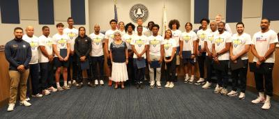 Wheeler High School boys basketball team poses at meeting with commissioners