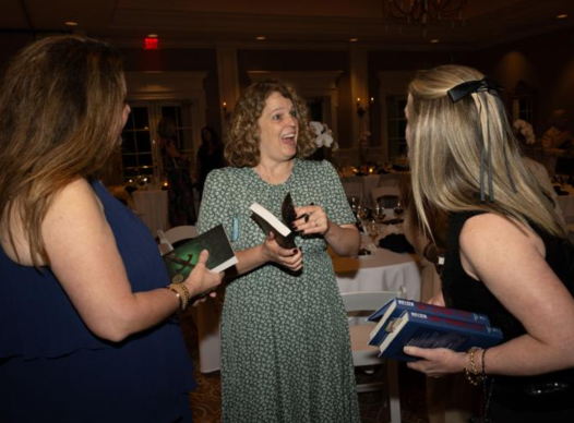 Author Jennifer Nielsen greets Cobb Library Foundation members at its fundraising evening at the Atlanta Country Club.