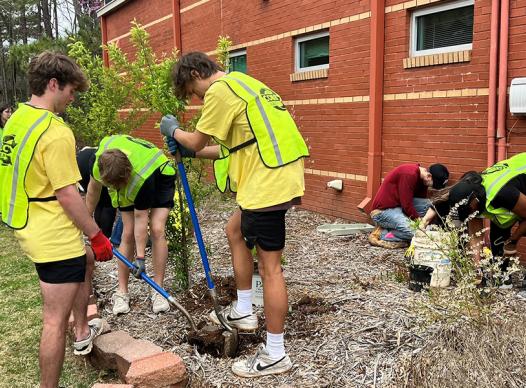 Volunteers planting at the Riverside Community Garden during the D4 Earth Day cleanup