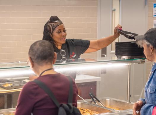Women serving food to other women