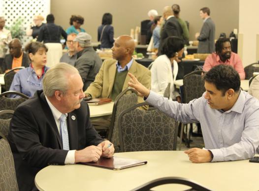 business people networking sitting at a table