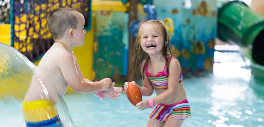 two kids playing in waterpark