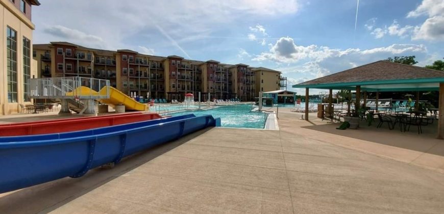 The bottom of the two slides going into the pool