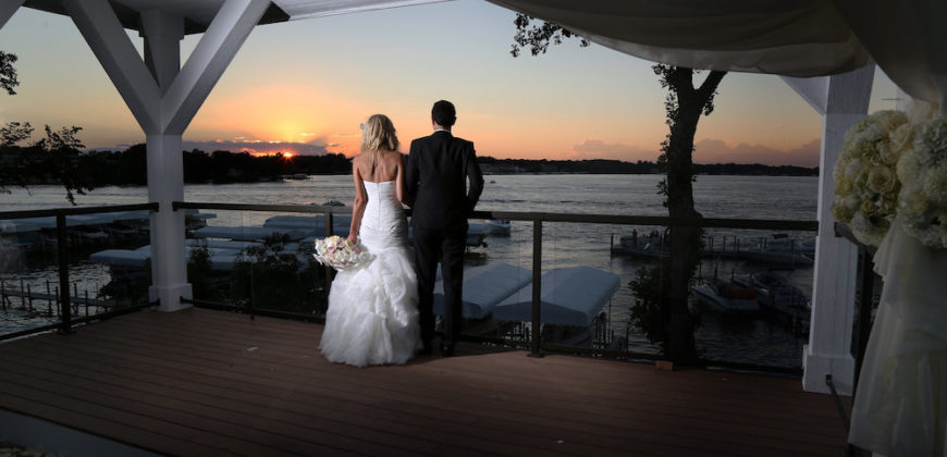 Wedding Couple at Sunset looking out at the water