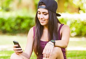 Teenager looking at cell phone