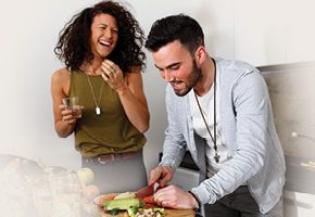 Young couple cooking at home