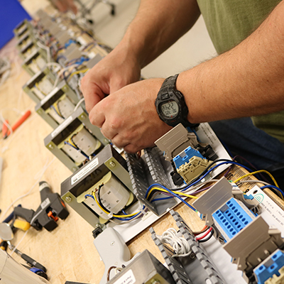 A PTS Products employee working on equipment