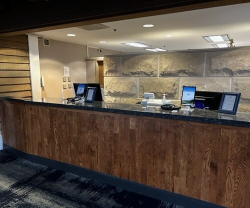 Front desk with touchless kiosks