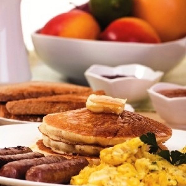 Breakfast with sausage, eggs, and pancakes