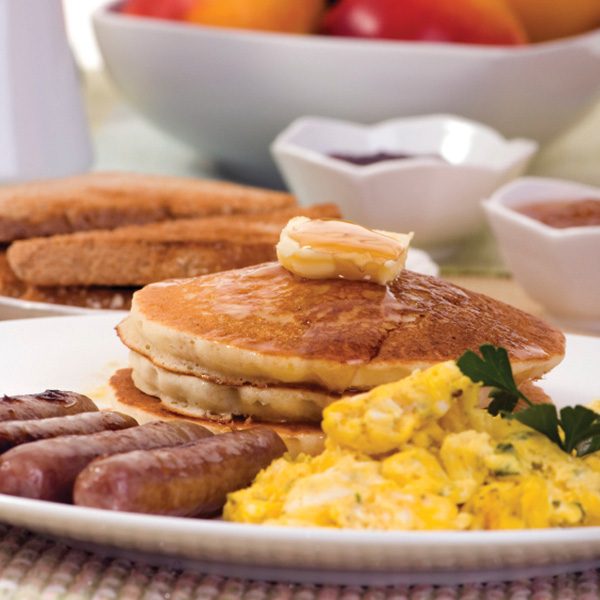 Breakfast with sausage, eggs, and pancakes