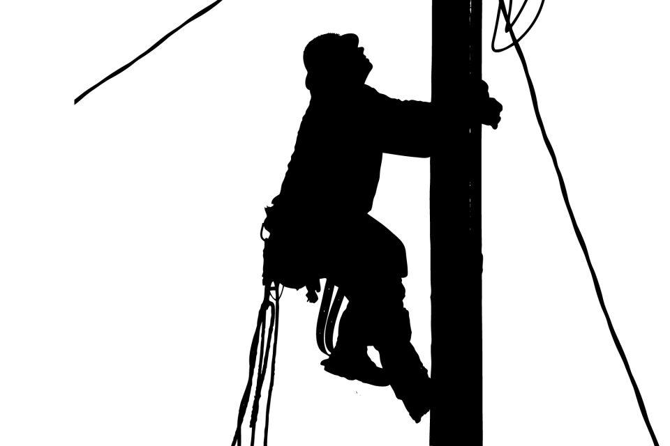 Image features a lineman climbing to the top of a power pole.
