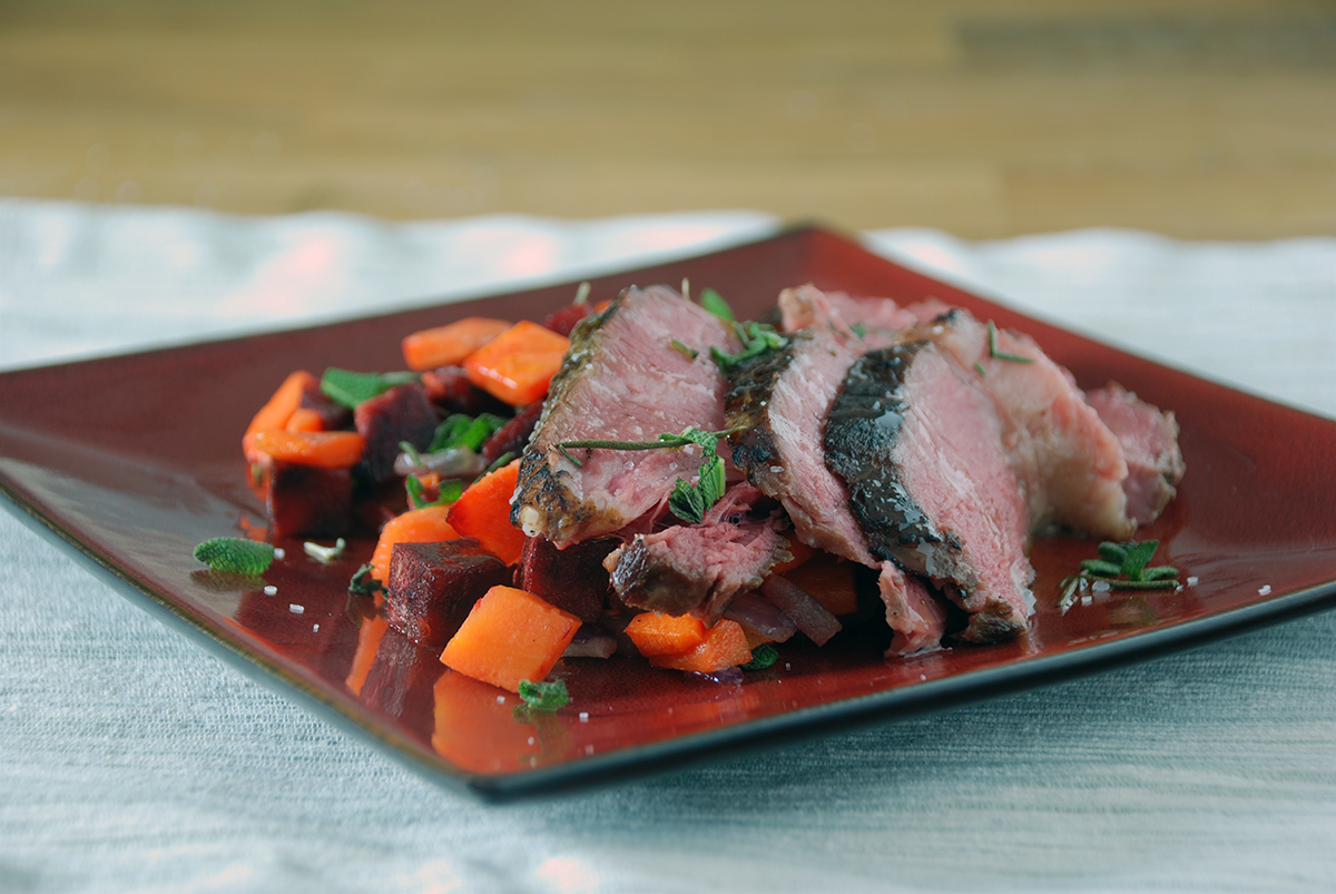 Sous vide sirloin roasted vegetables plated