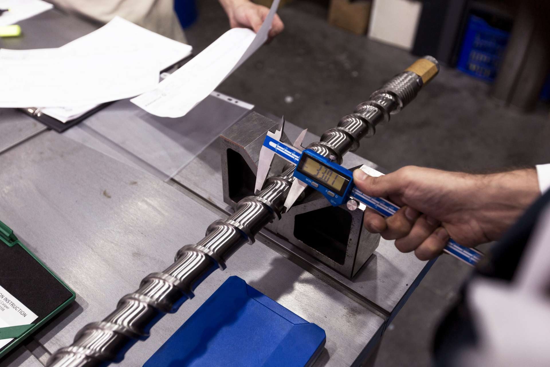 Are there any specialized tools or techniques for removing abrasive particles from firearm barrels to prevent grooving?