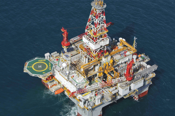 Offshore drilling platform 'Alpha Star' in operation, with detailed structure and helideck visible in the open sea.