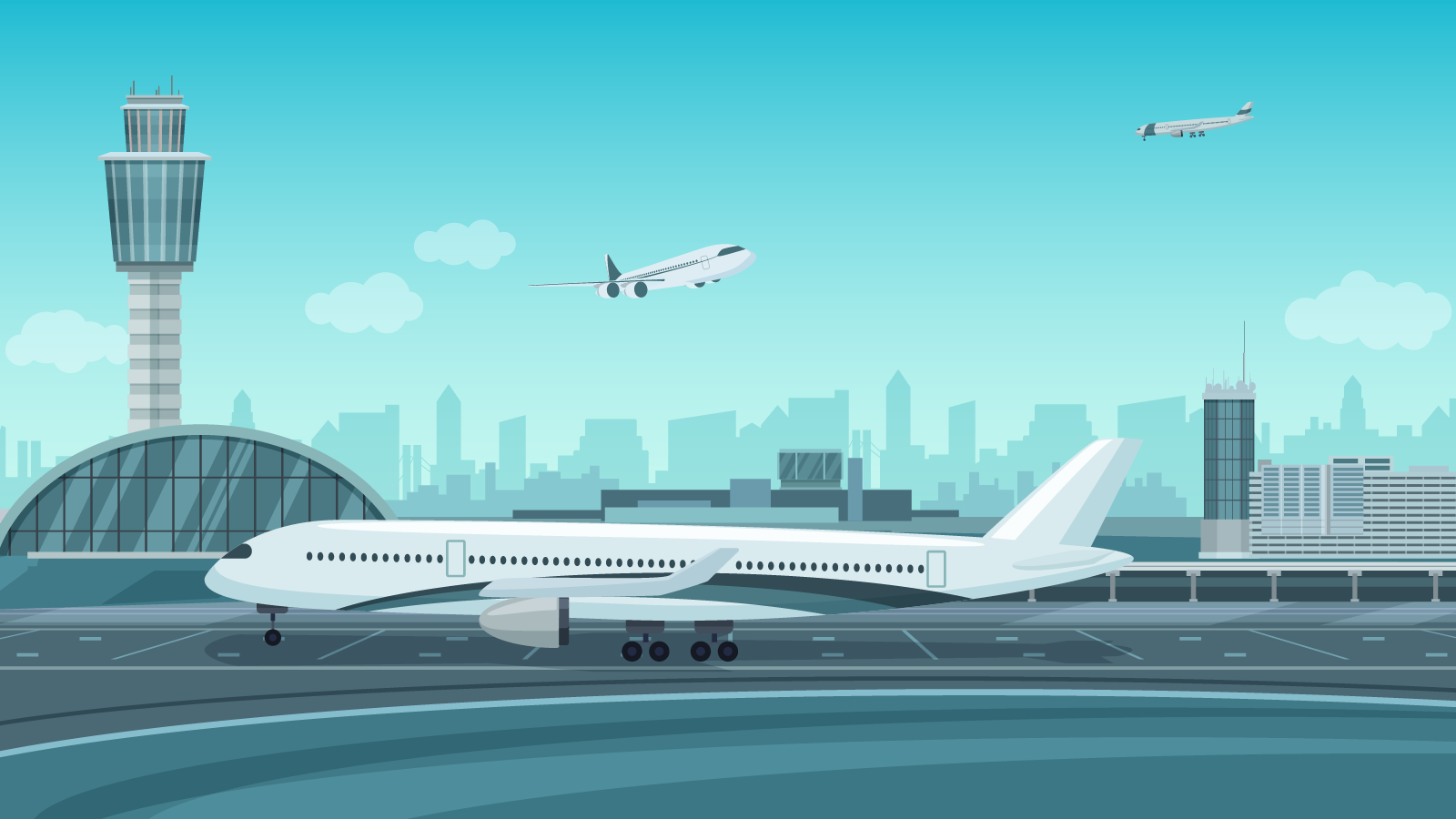 A large airplane at the airport on the runway getting ready for takeoff.