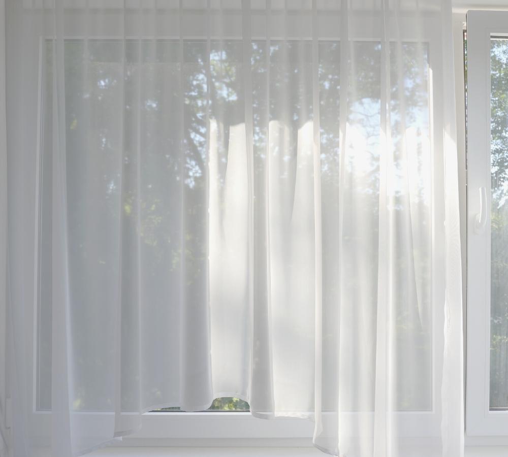 sheer curtain allows light through but is difficult to see objects outside