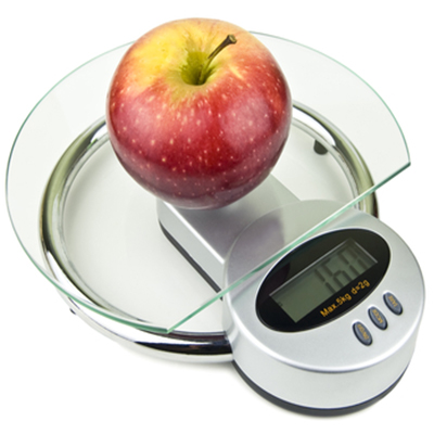A red and yellow apple on a round glass digital scale displaying a numerical reading of 160 grams.