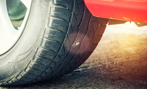 nail stuck in a car’s tire