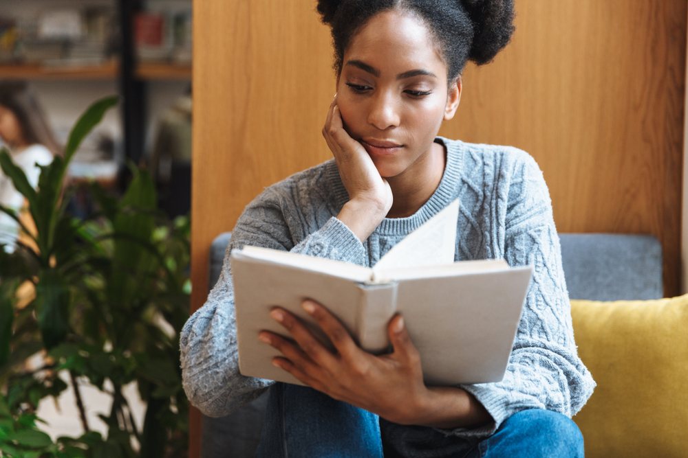 young woman reading a book