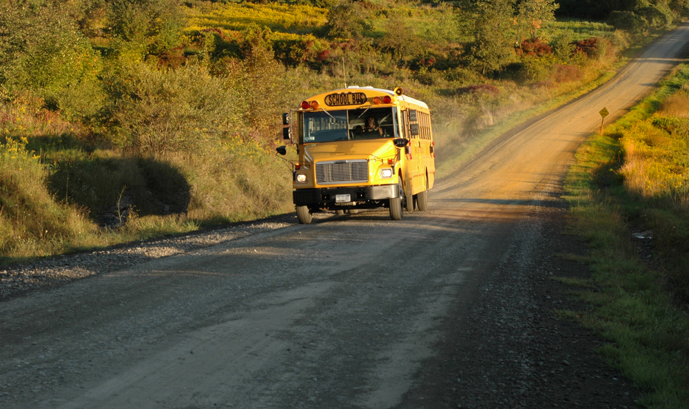 A country school bus makes it's way along its route 