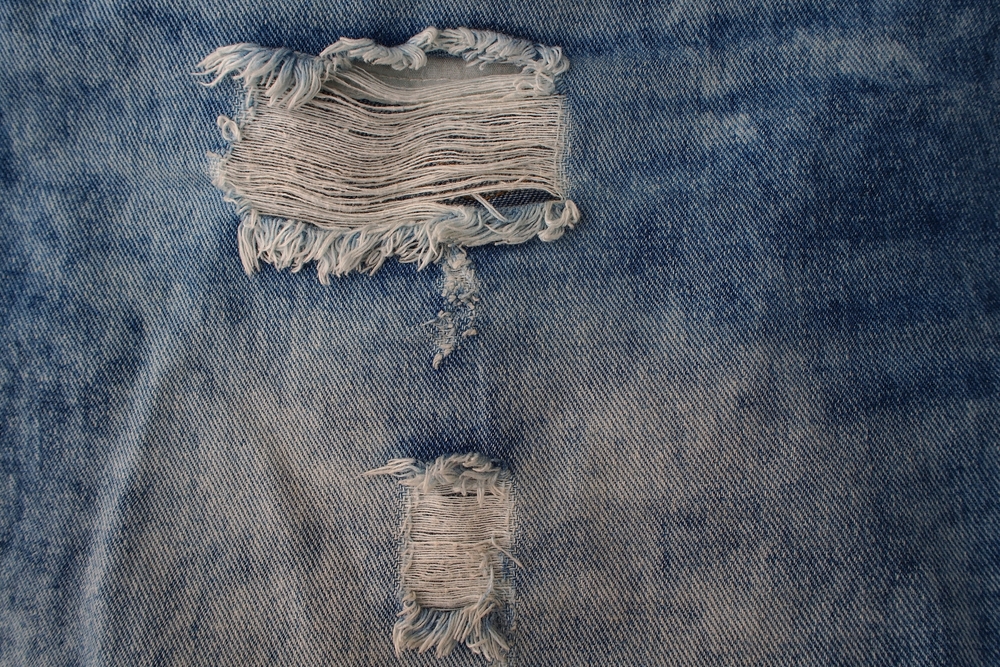 Torn blue jeans texture
