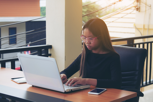 young woman working at a computer