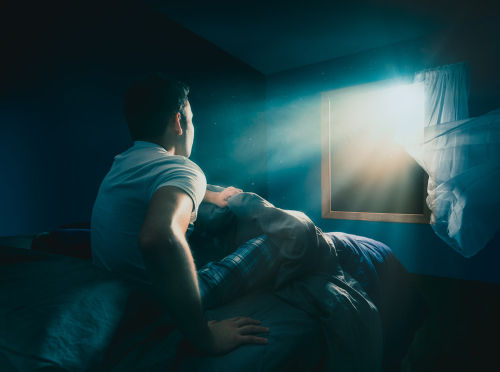 Young man getting abducted by an UFO / high contrast image