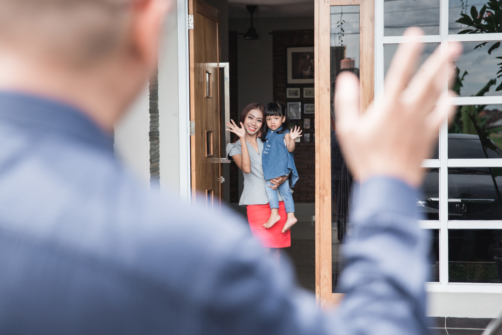 man waving to family