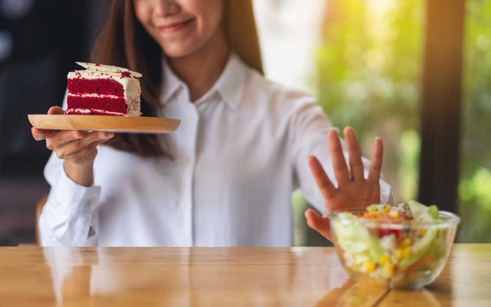 woman refusing salad