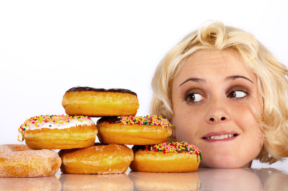 girl looking at donuts