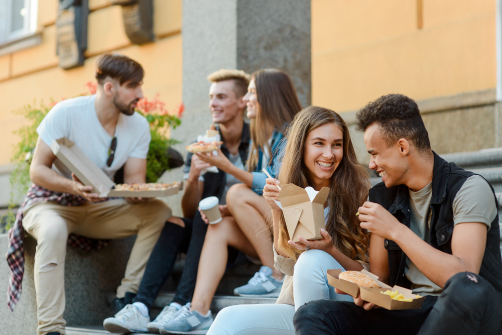 group of students talking outside of school