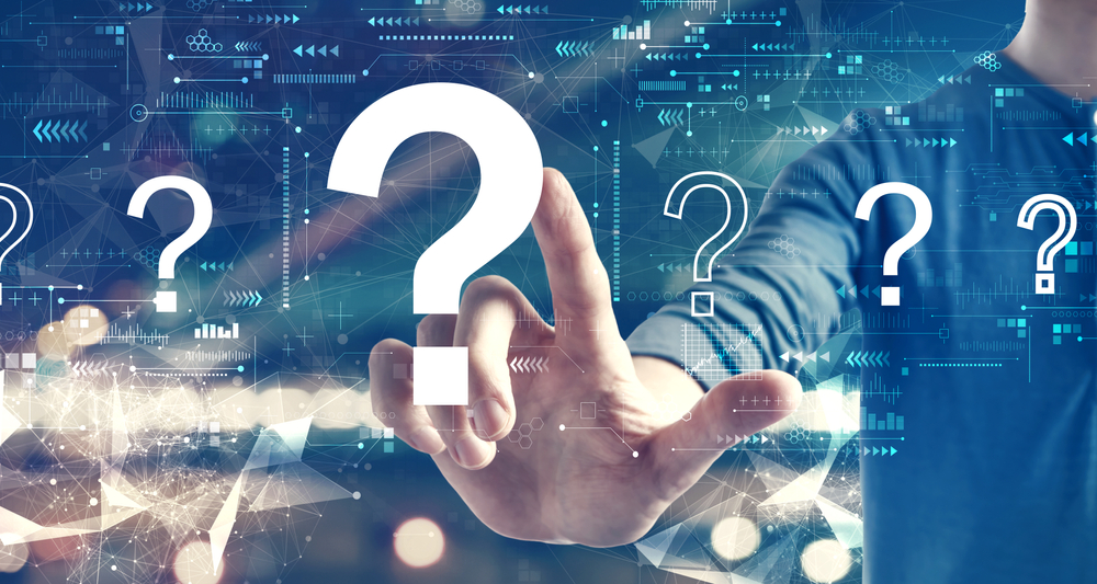 finger pointing to a question mark