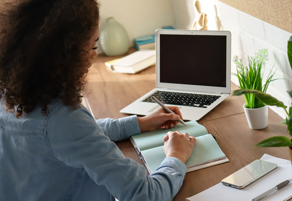 girl typing on computer