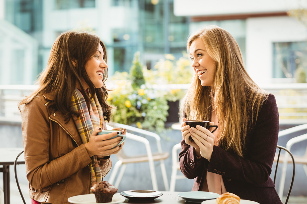 two women having coffee at a coffee shop