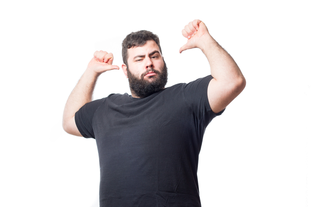 big man flexing pointing to himself