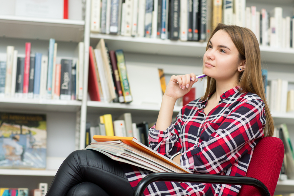 girl thinking in library