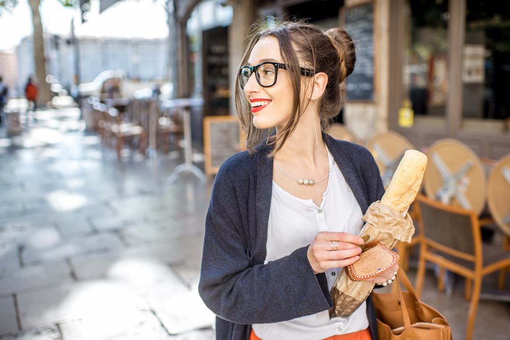 woman carrying bread
