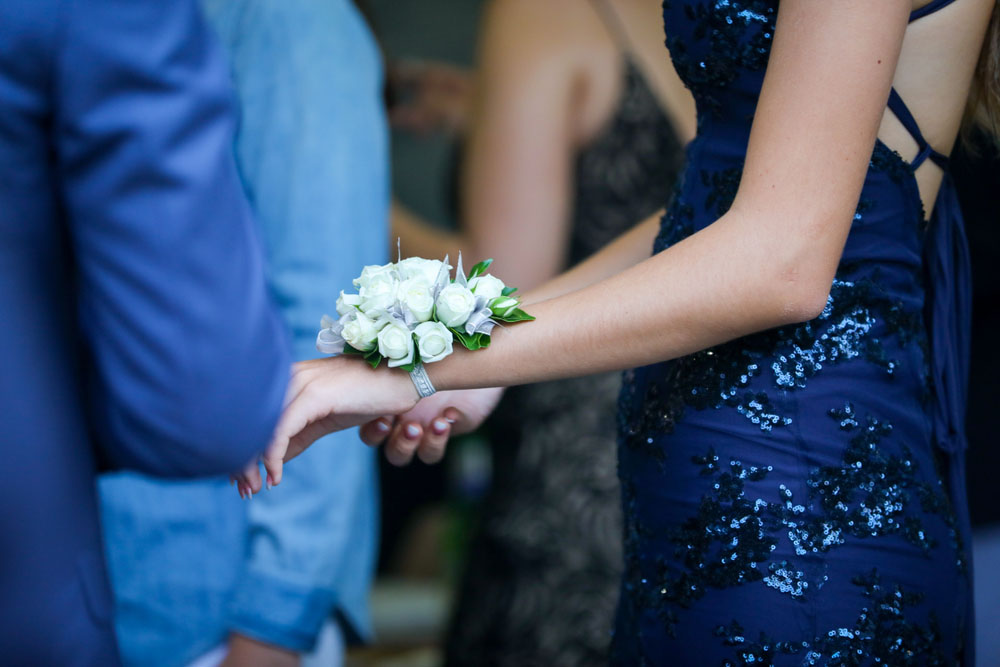 Student dancer wearing a wrist corsage.