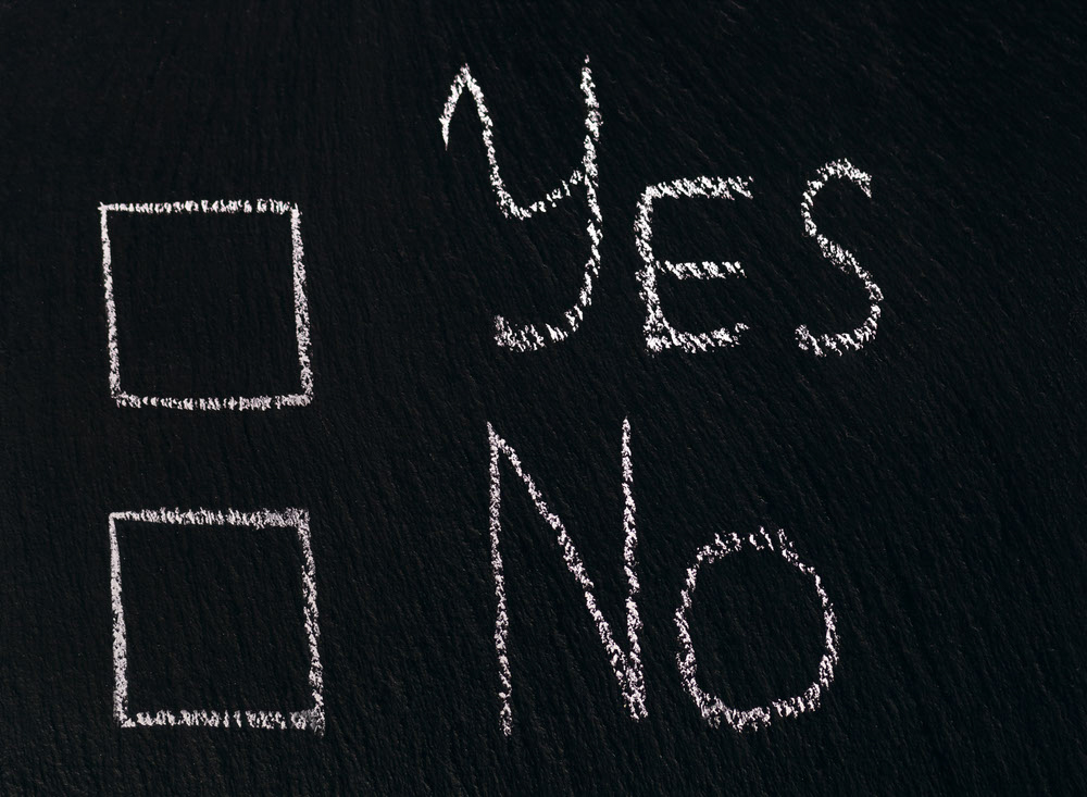 Yes No Checkbox sign on black chalkboard