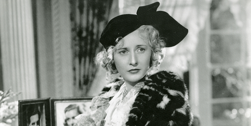 a black and white still of actress Barbara Stanwyck
