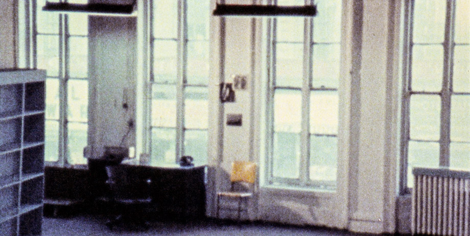 a grainy, stylized shot of a room with lots of windows