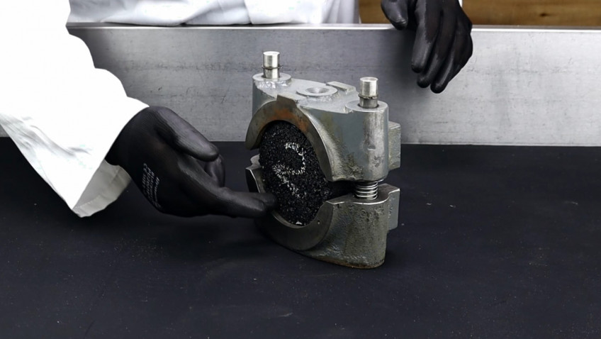Determining the Stability and flow of a compacted asphalt briquette