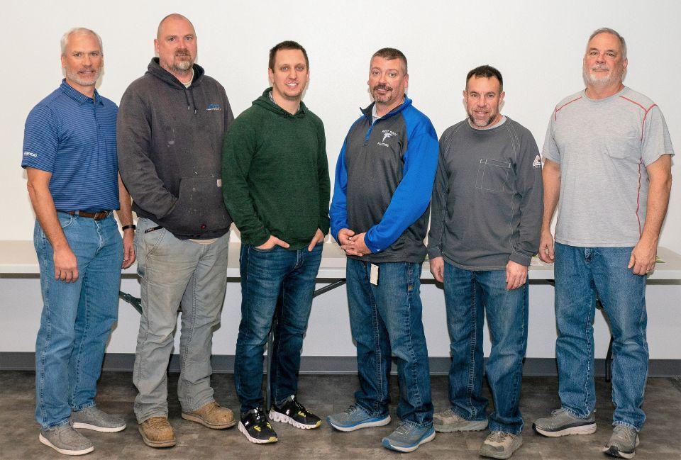 Group photo of service anniversary recipients.