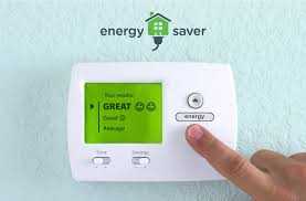 cover for the booklet, hand adjusting a wall thermostat
