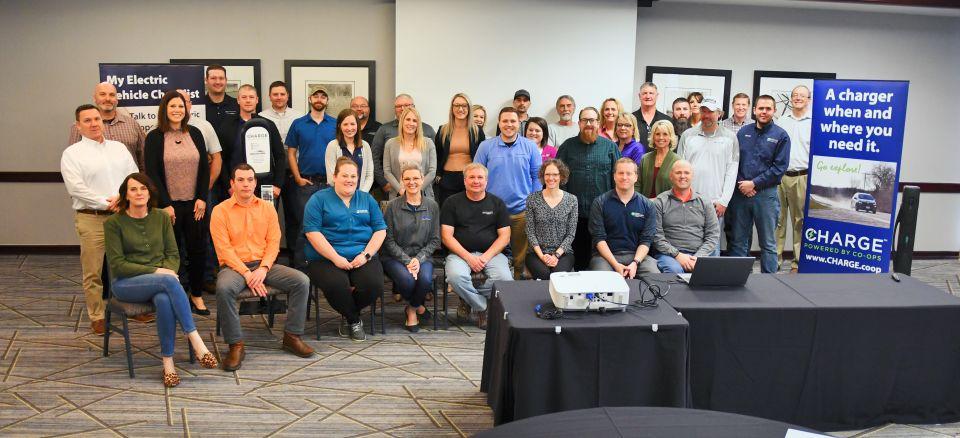 Photo of meeting participants posing together.