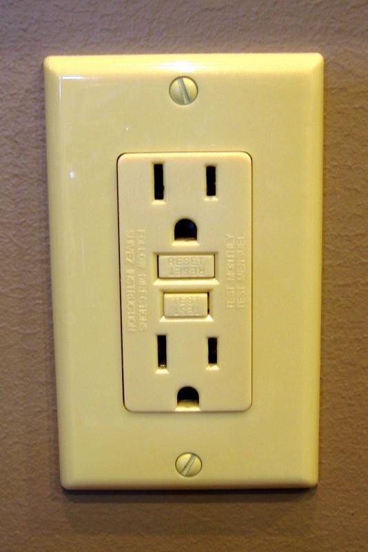 Image of GFCI outlet plug installed on a wall