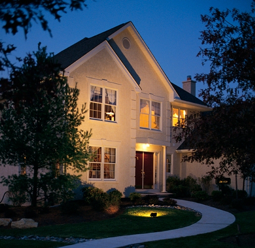 a house at dusk that is lit up