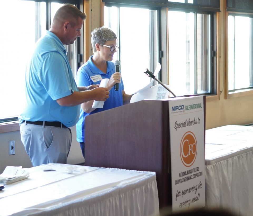 Photo of a meal sponsor sign on the podium